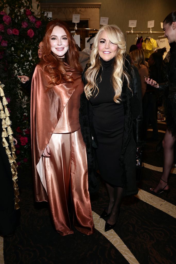 Lindsay Lohan and Dina Lohan pose backstage at the Christian Siriano Fall/Winter 2023 NYFW Show at Gotham Hall on February 09, 2023 in New York City
