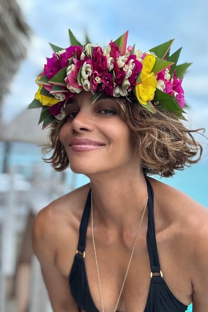 Photo shared by Halle Berry of her in a swim suit and a flower crown while celebrating her birthday on a beach vacation