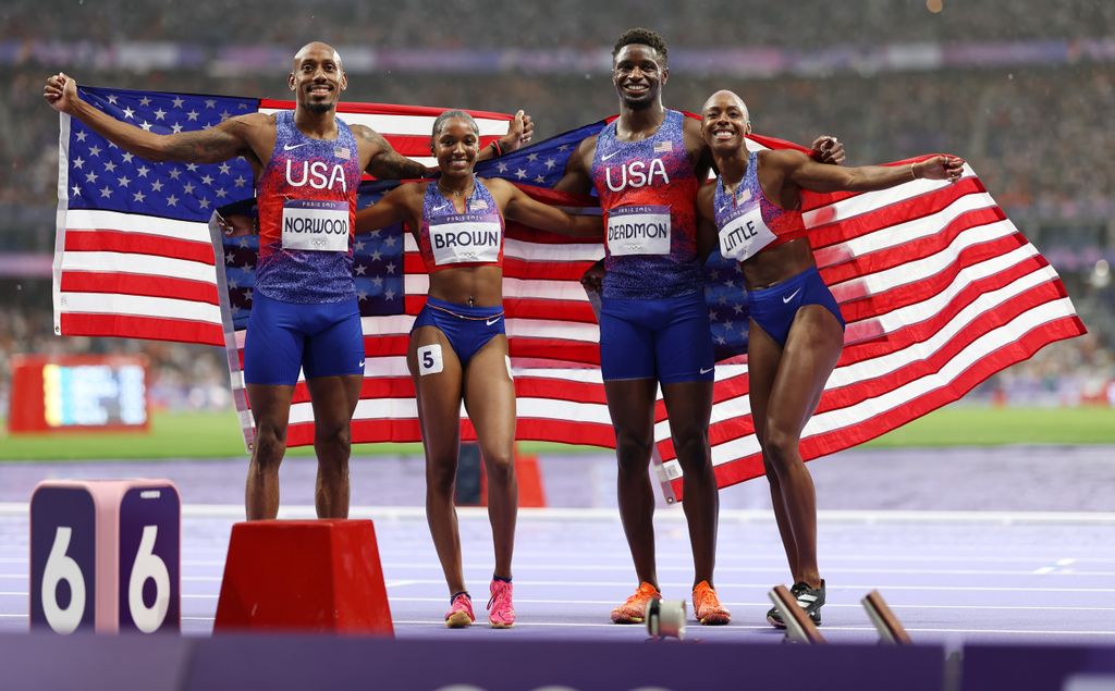 Bryce Deadmon, Vernon Norwood, Kaylyn Brown and Shamier Little of Team United States celebrate winning silver during the 4 x 400m Relay Mixed final on day eight of the Olympic Games Paris 2024 at Stade de France on August 03, 2024 in Paris, France.