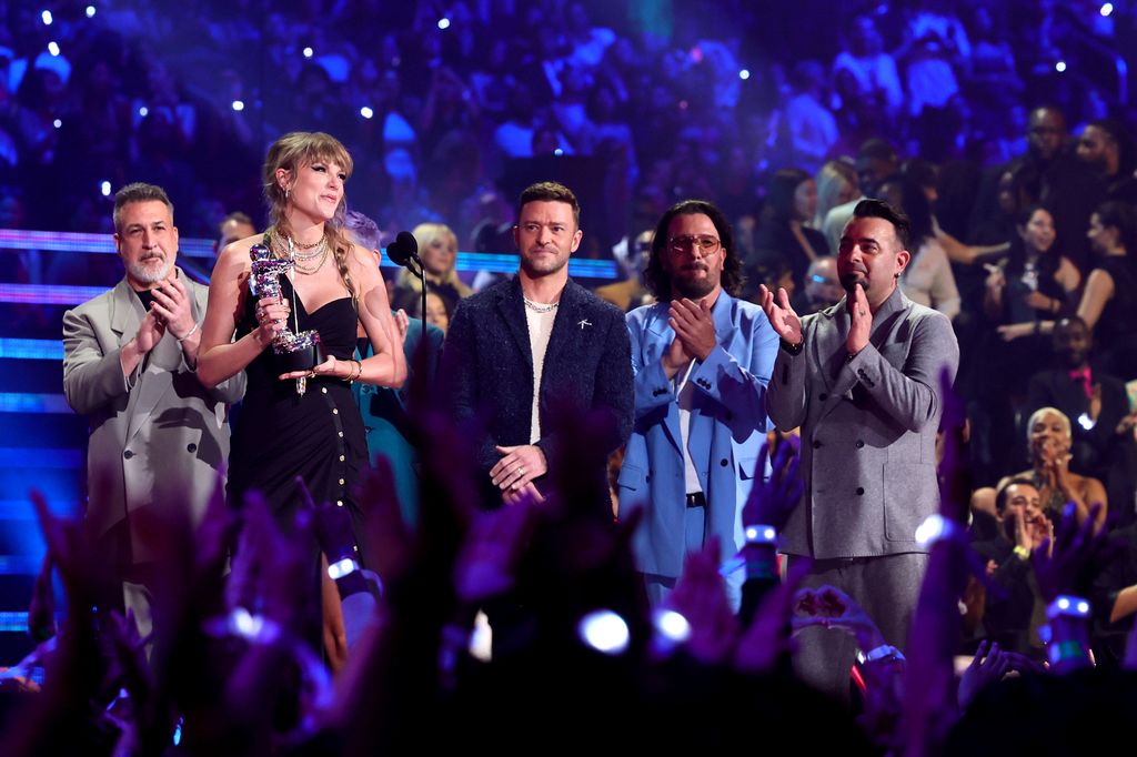 Taylor Swift (2nd L) accepts the Best Pop award for "Anti-Hero" from (from L) Joey Fatone, Justin Timberlake, JC Chasez, and Chris Kirkpatrick of *NSYNC 