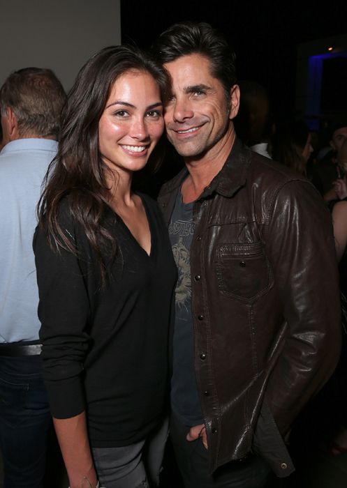 john stamos and caitlin mchugh at comicon party