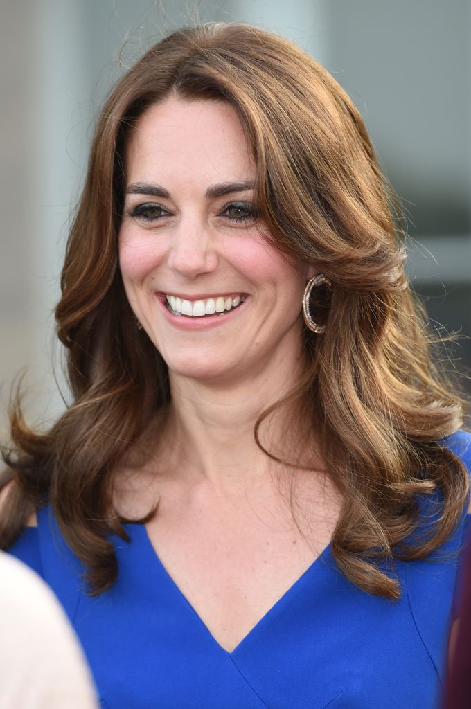 Catherine close up smiling in blue dress