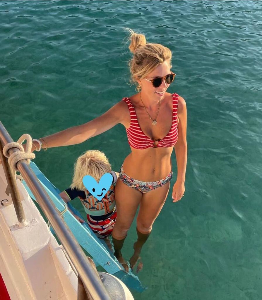 A photo of Carrie Johnson and her son Wilf holding onto a boat