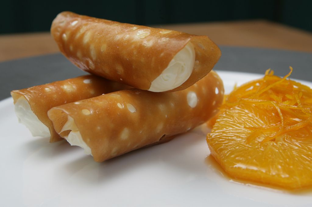 Food shots --- "Brandy Snaps w/ Caramelized Oranges" at The Pawn in Wanchai. 31 MARCH 2008 (Photo by Edward Wong/South China Morning Post via Getty Images)