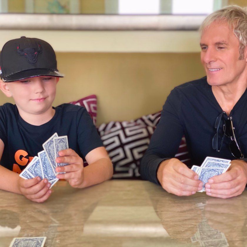 Michael Bolton with his grandson playing cards