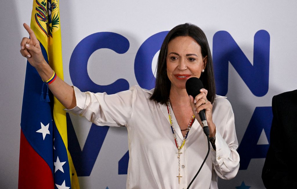 Maria Corina Machado in white shirt talks to the media in Caracas on July 29, 2024