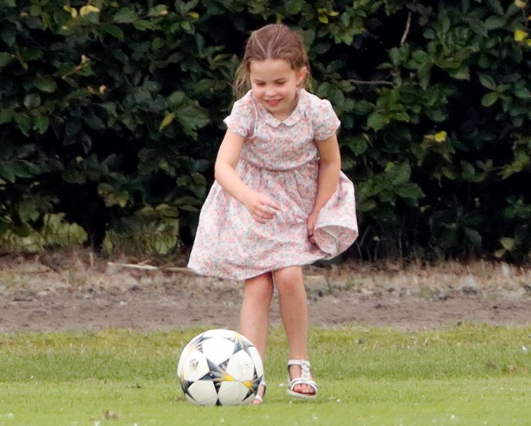 Princess Charlotte kicking football