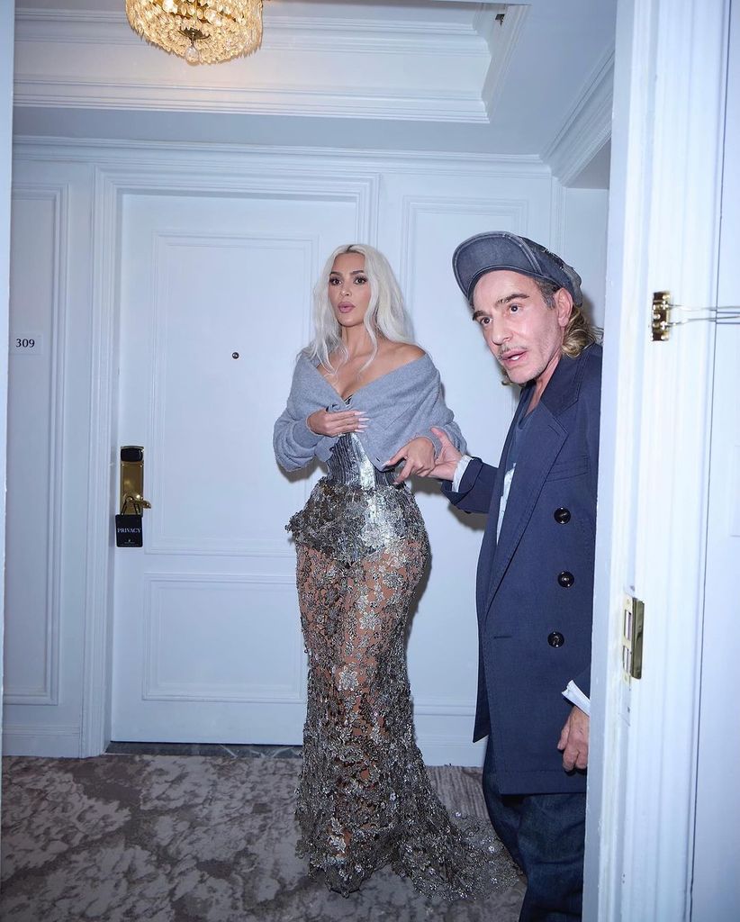 Kim teetering in her mega heels as she gets ready for the Met Gala with John Galliano