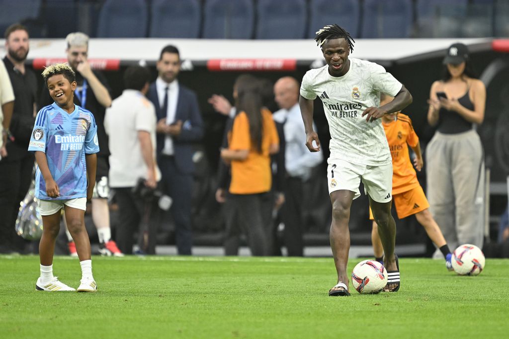 Vinicius Junior of Real Madrid plays football with Kim Kardashian's son