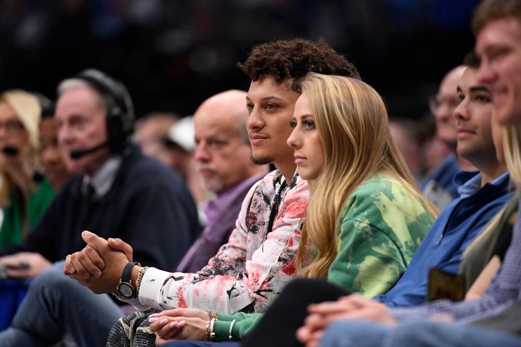 The couple enjoying a game courtside