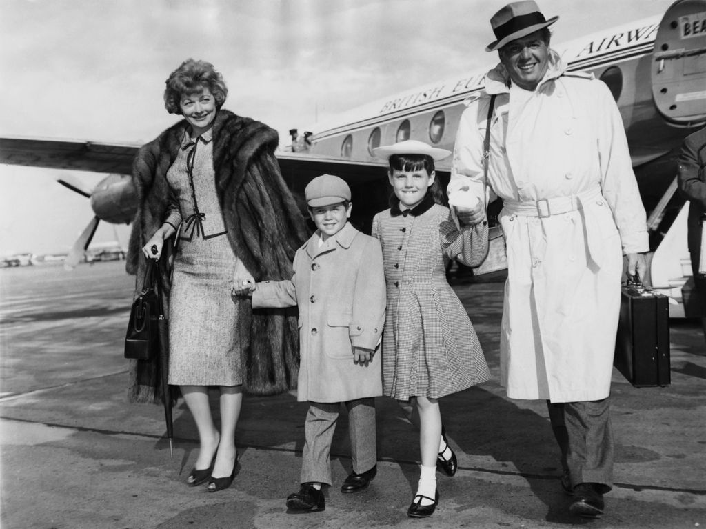 Lucille Ball and her husband Desi Arnaz arrive at London Airport with their children Lucie and Desi Jr., 10th June 1959. They have just arrived from Naples for a three-day visit.