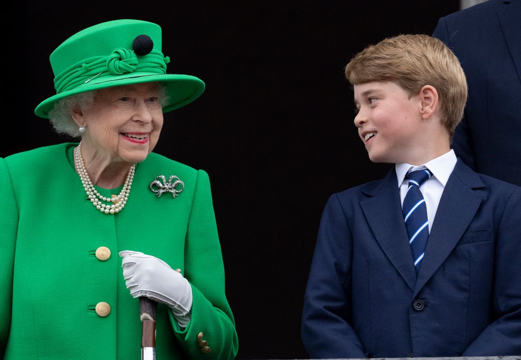 Queen Elizabeth II and Prince George of Cambridge smiling next to eachother 