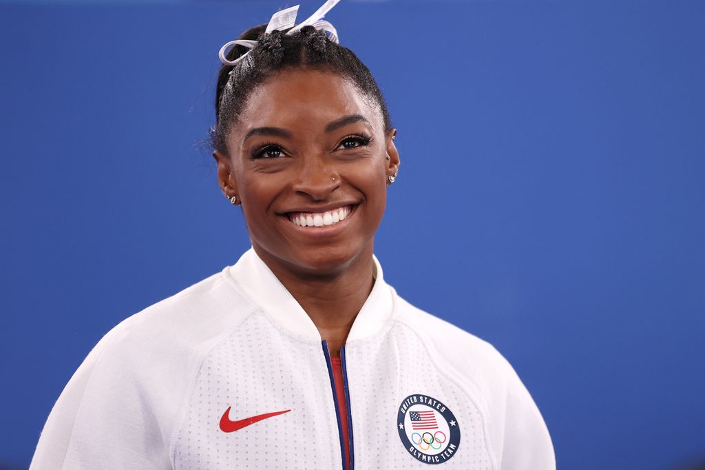 Simone Biles of Team United States smiles during the Women's Team Final on day four of the Tokyo 2020 Olympic Games at Ariake Gymnastics Centre on July 27, 2021 in Tokyo, Japan. (Photo by Laurence Griffiths/Getty Images)