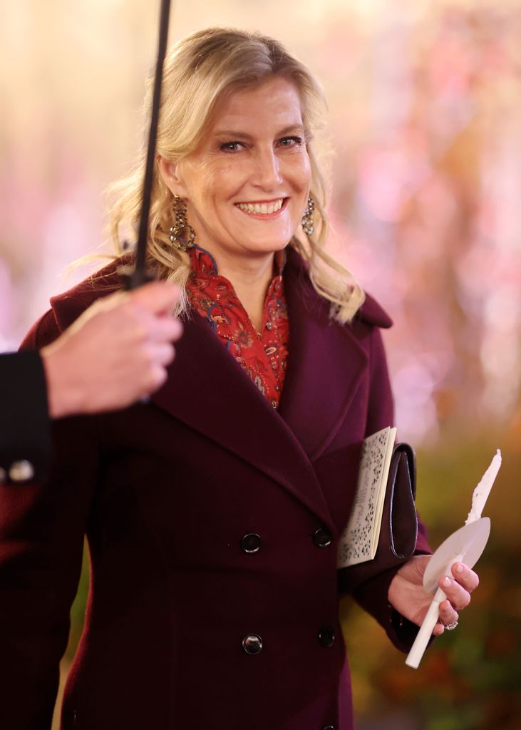 Sophie, Duchess of Edinburgh smiling under umbrella