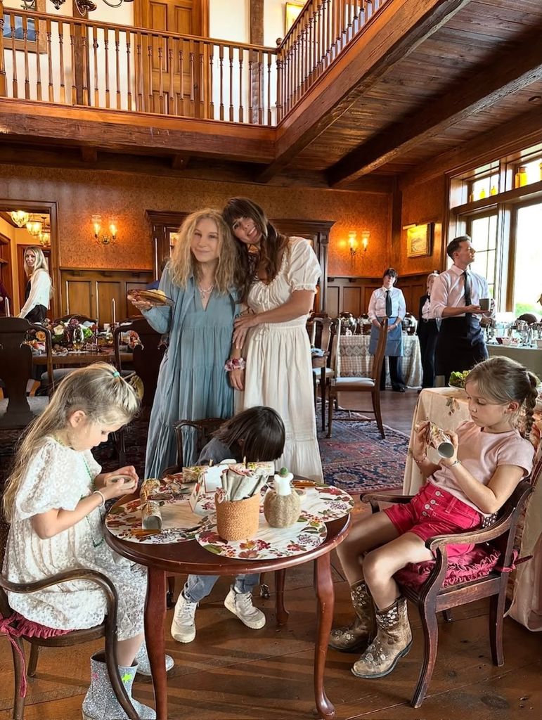 Barbra Streisand and Molly Brolin pose for a photo surrounded by the former's grandchildren at her home in Malibu on Thanksgiving, shared on Instagram