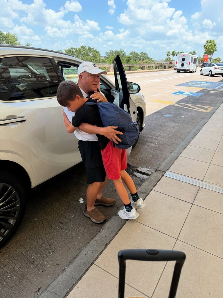 Wolfie Mapelli Mozzi hugging his grandfather