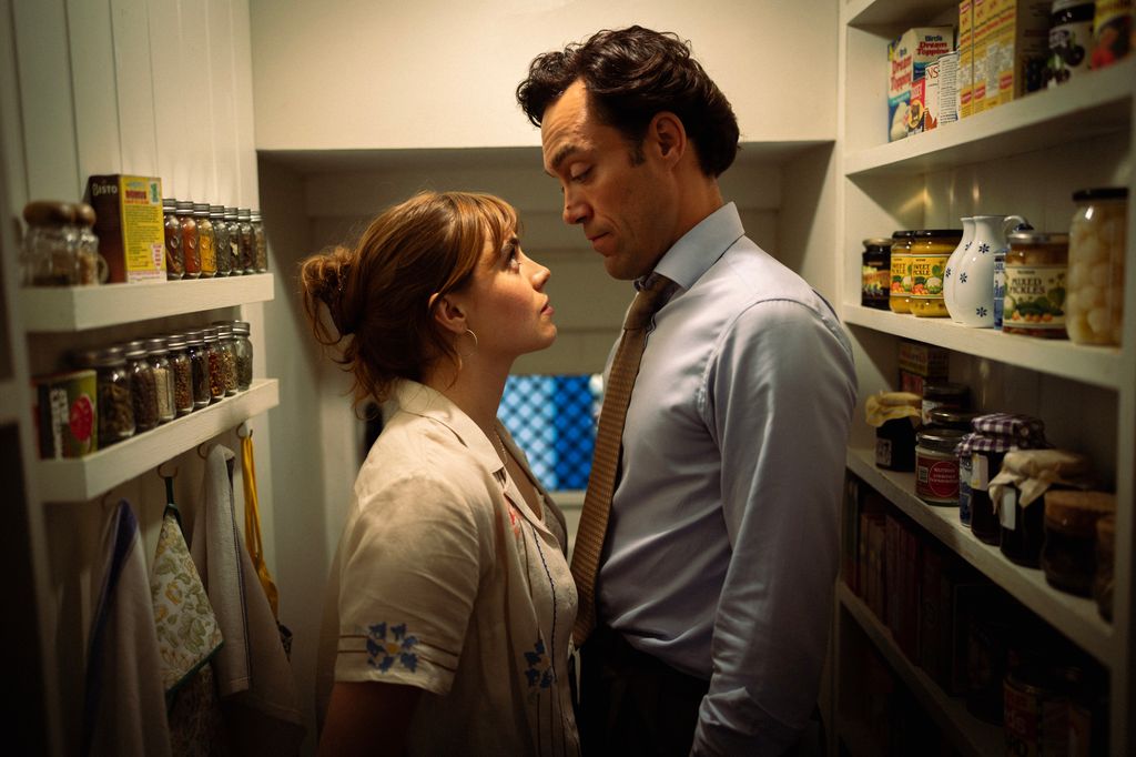 man and woman in food cupboard