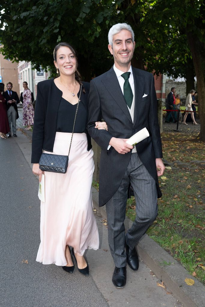 Princess Alexandra and Prince Nicolas walking at a wedding ceremony
