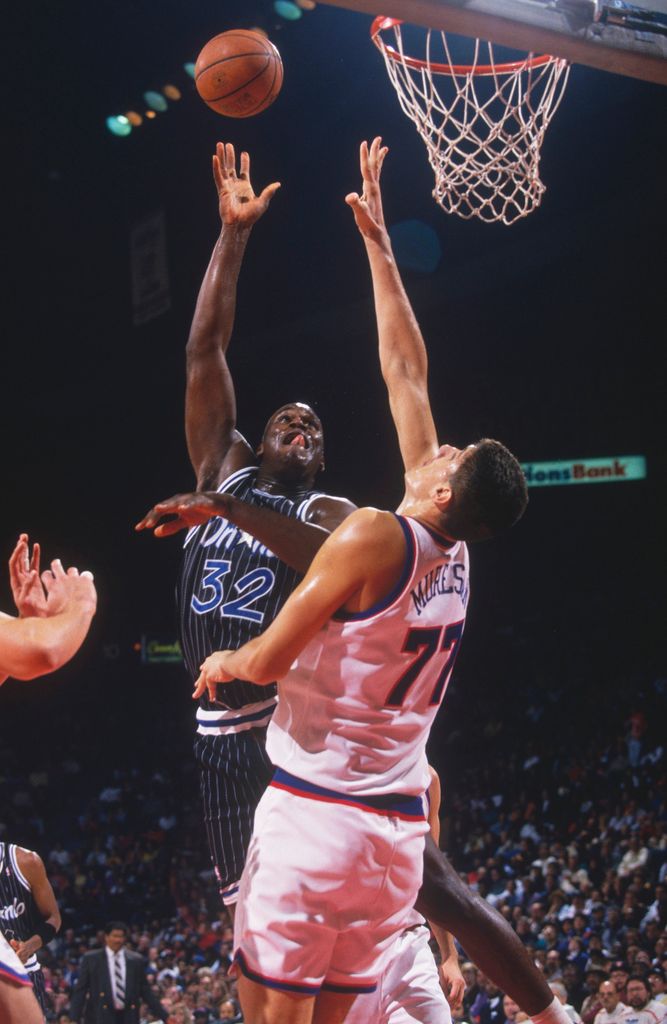 Orlando Magic' center Shaquille O'Neal jumps and shoots during a game against the Washington Bullets at Capital Center circa the 1990's 