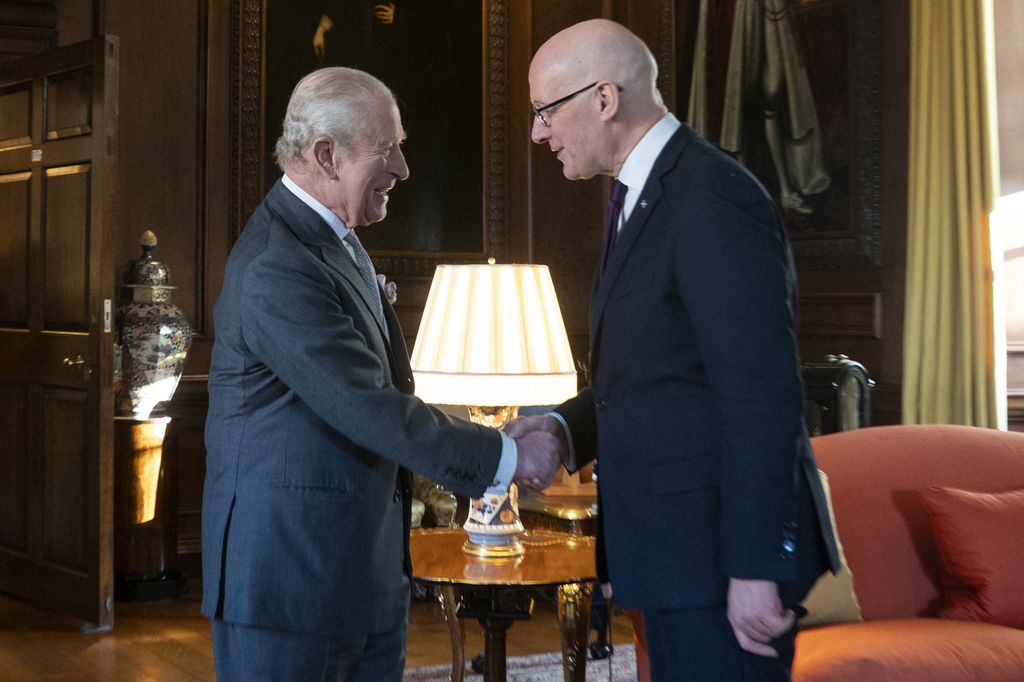 The King shakes hands with First Minister of Scotland John Swinney