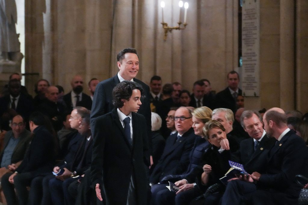 Tesla CEO Elon Musk (C) arrives to attend a ceremony to mark the re-opening of the landmark Notre-Dame Cathedral 