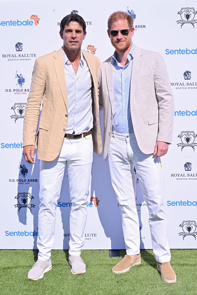 Nacho Figueras standing with Prince Harry