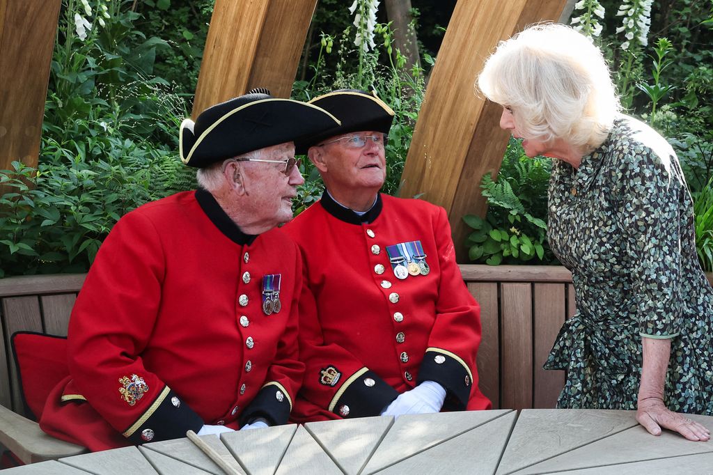queen camilla talking to chelsea pensioners members