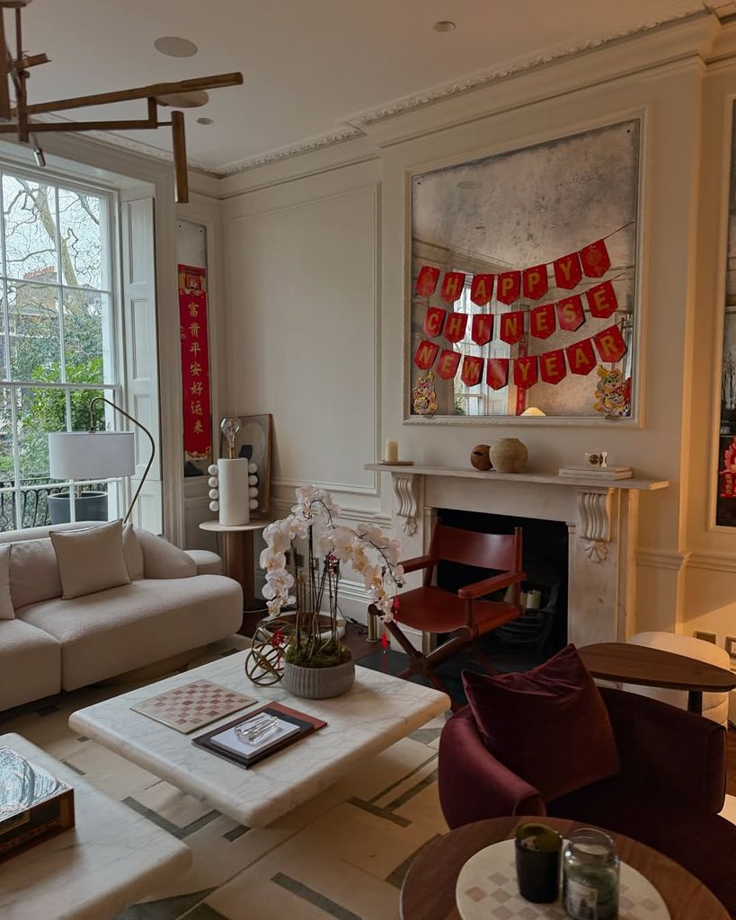 Dara Huang's living room with red and gold decorations