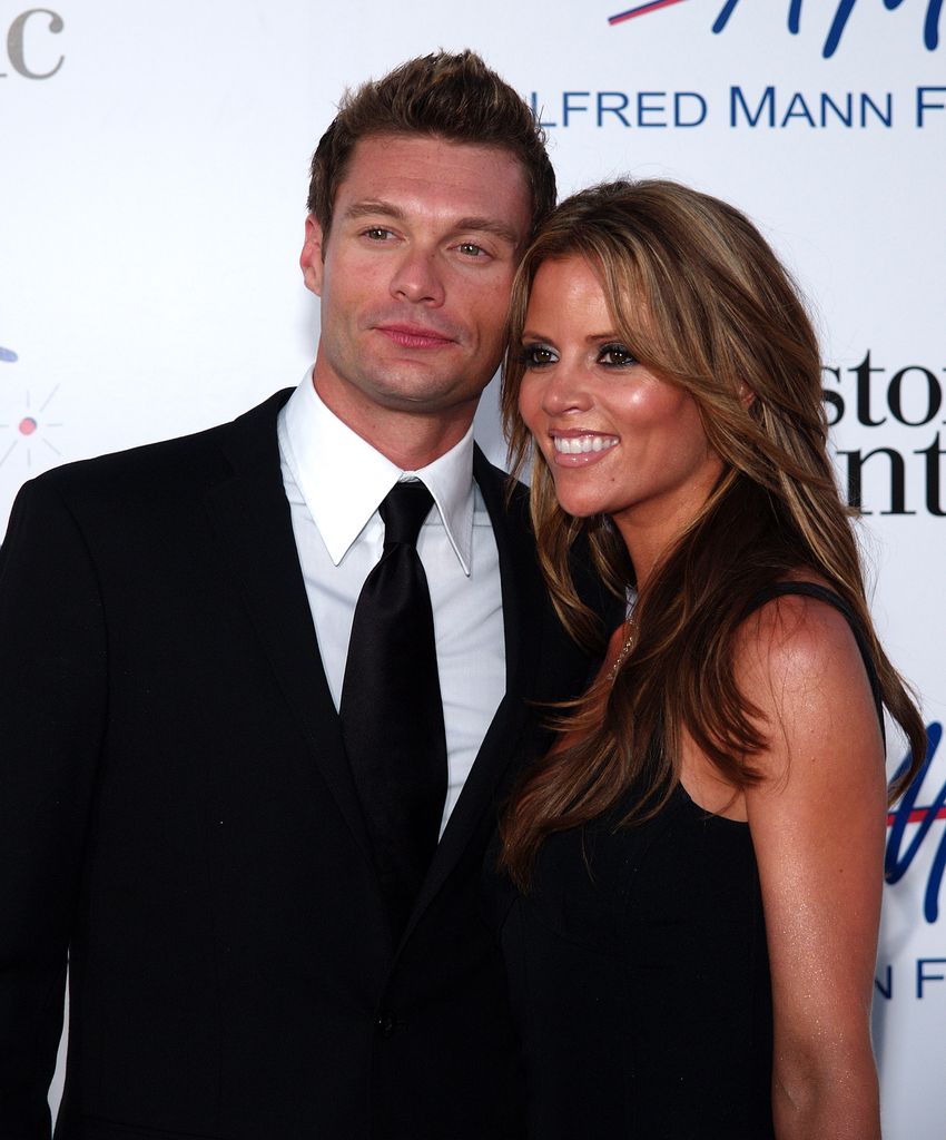 Ryan Seacrest and Shana Wall in smart clothes 