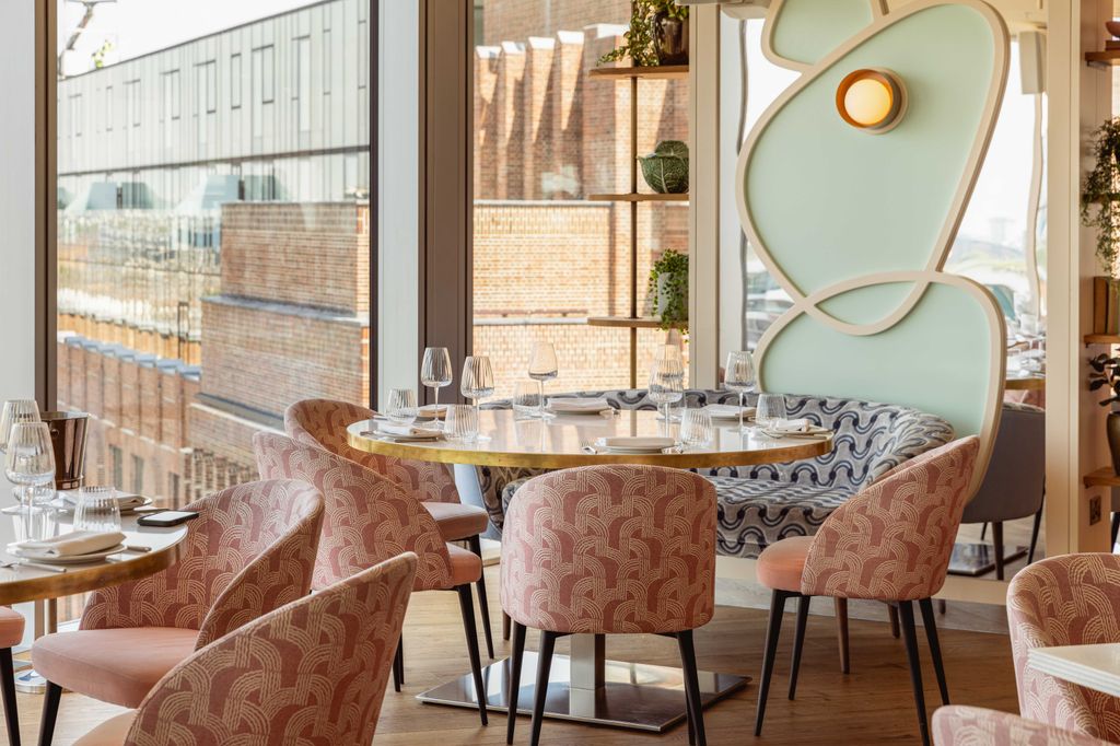 view of restaurant with pastel chairs