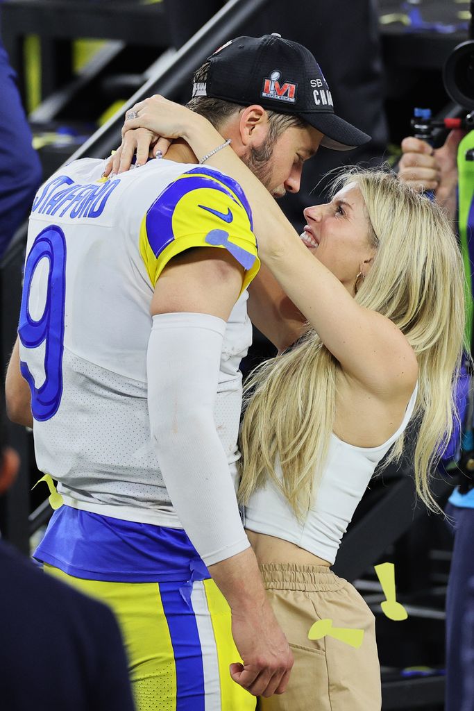 Matthew Stafford #9 of the Los Angeles Rams celebrates with his wife Kelly Stafford during Super Bowl LVI at SoFi Stadium on February 13, 2022 in Inglewood, California. The Los Angeles Rams defeated the Cincinnati Bengals 23-20.  (Photo by Andy Lyons/Getty Images)