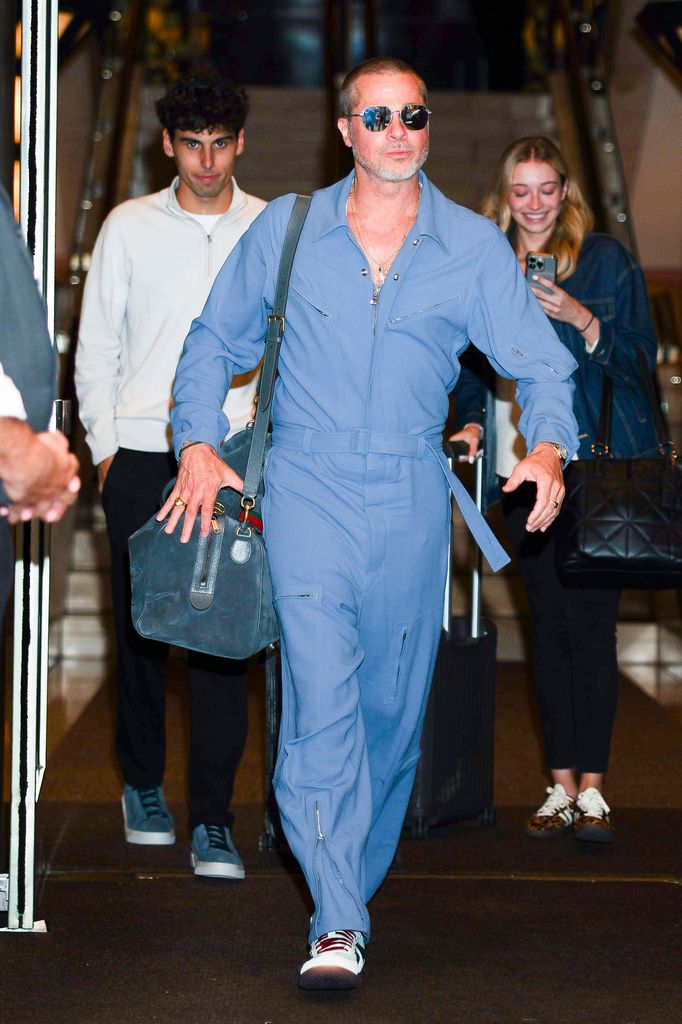 Brad Pitt in a utilitarian-style blue jumpsuit