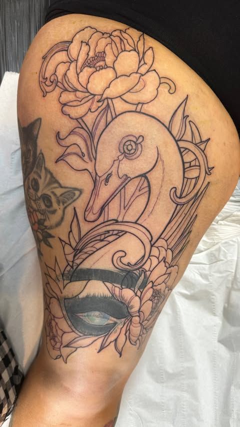 large thigh tattoo with swan design