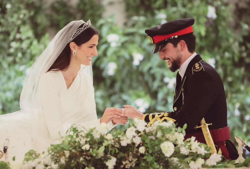 Crown Prince Al Hussein and his bride Rajwa Al Saif exchange rings during the wedding ceremony