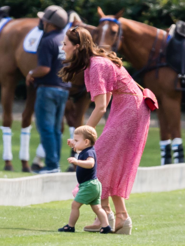 Kate Middleton walking with Prince Louis at polo, 2019