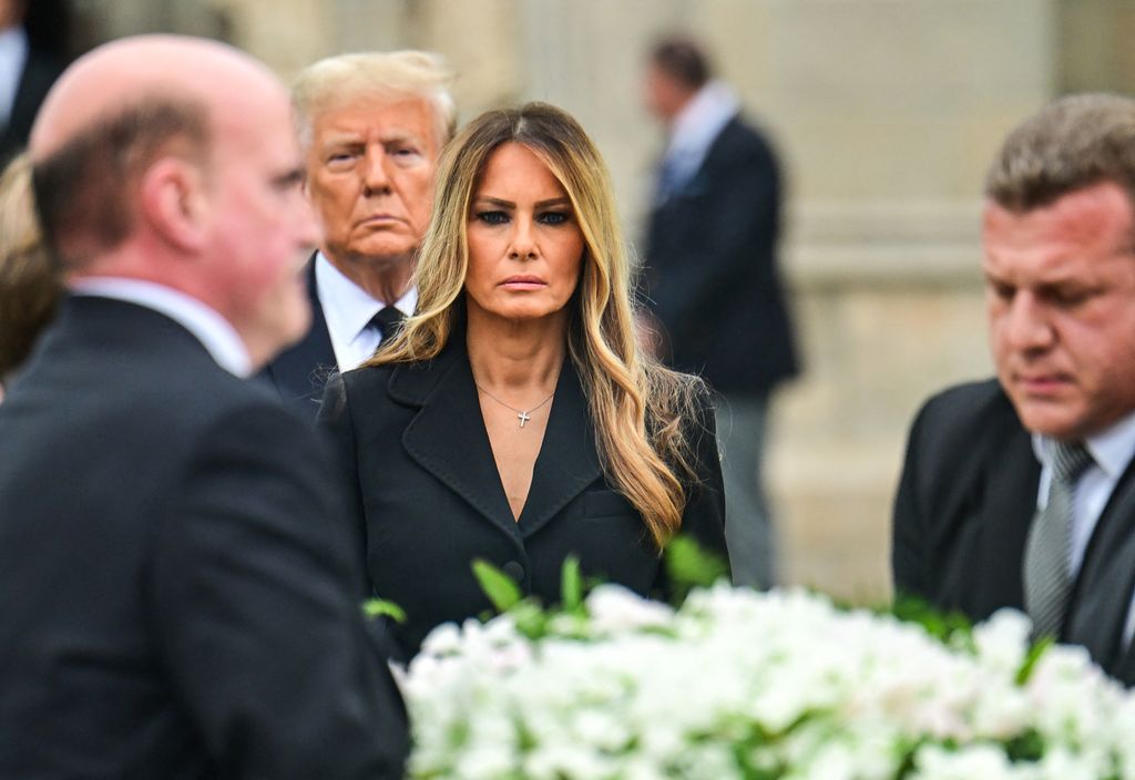 Former US First Lady Melania Trump (C), with her husband former US President Donald Trump (rear), leaves the funeral service for her mother, Amalija Knavs, at the Church of Bethesda-by-the-Sea in Palm Beach, Florida, on January 18, 2024. 