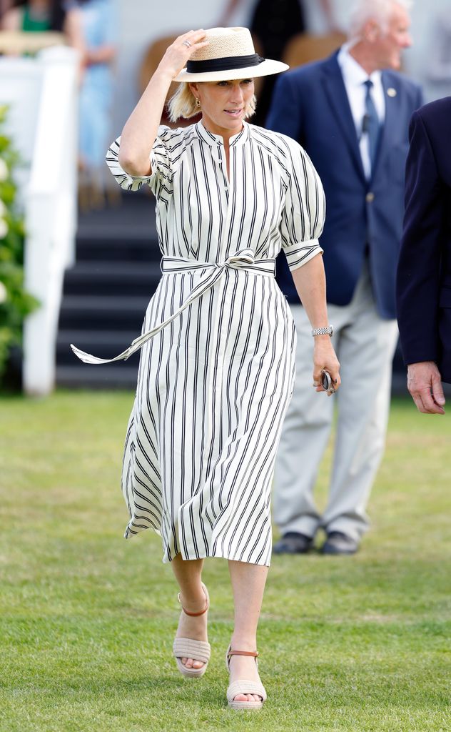 Zara Tindall on grass in striped shirt dress