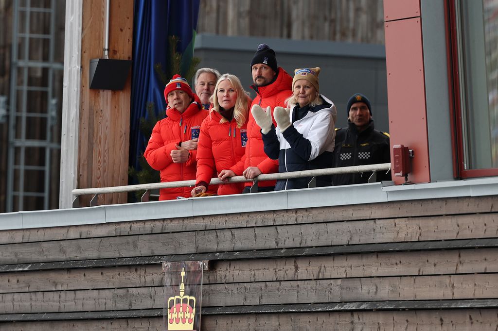 Crown Princess Mette-Marit and Crown Prince Haakon watching skiing