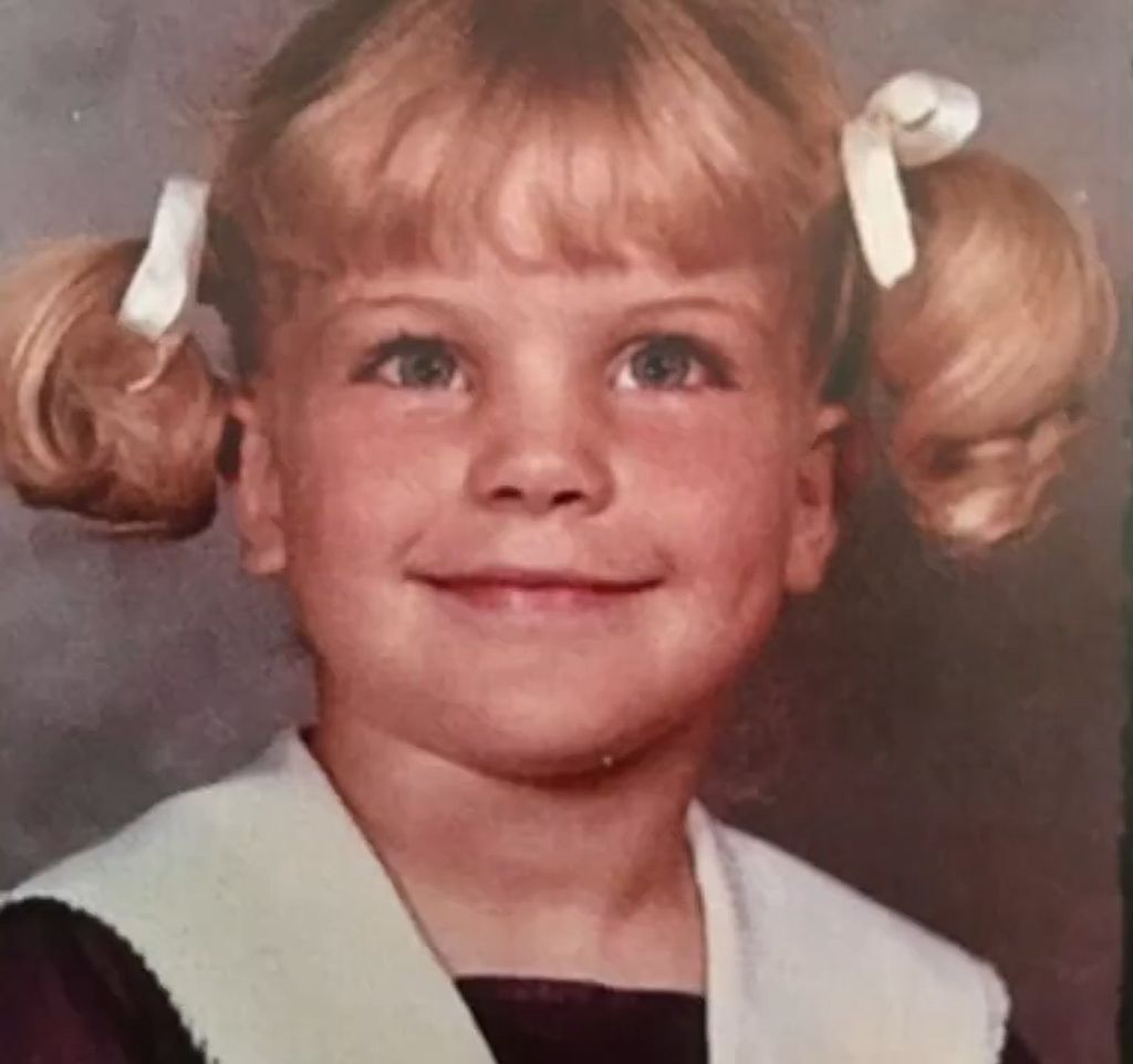 Pauley Perrette as a young toddler with blonde pigtails