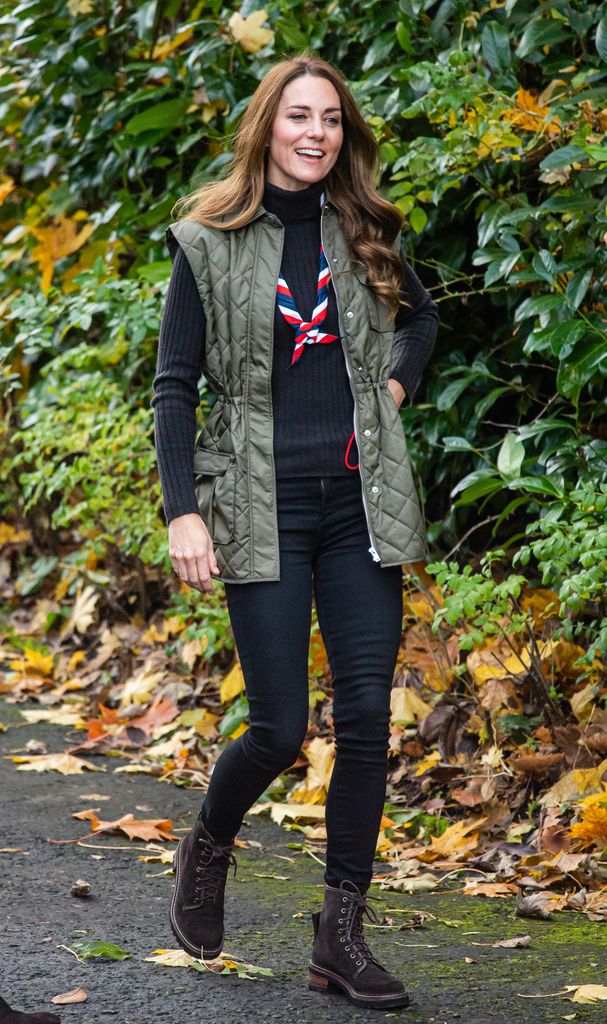 Catherine in black jeans and khaki gilet