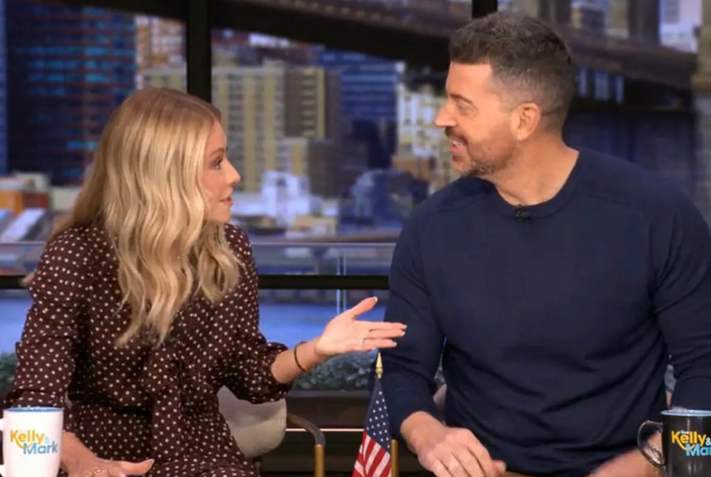 Kelly Ripa in polka dot dress and Steve Patterson in navy jumper on LIVE