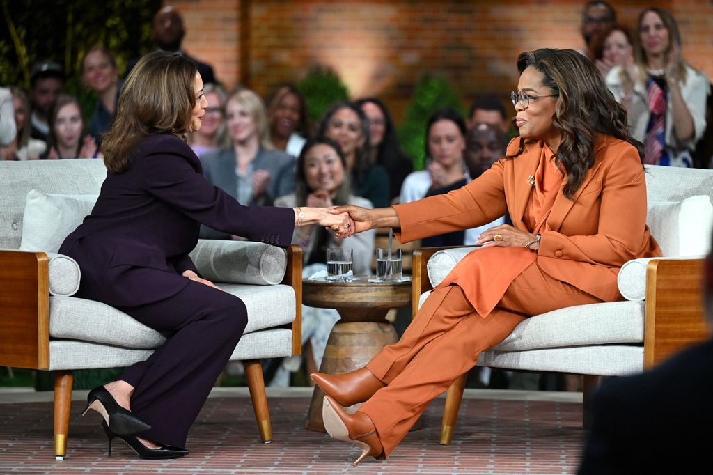 Kamala Harris (L) joins US television producer Oprah Winfrey at a 'Unite for America' live streaming rally in Farmington Hills, Michigan, on September 19, 2024