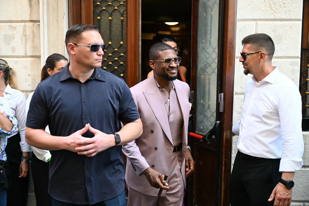 Usher rocked a pink look        