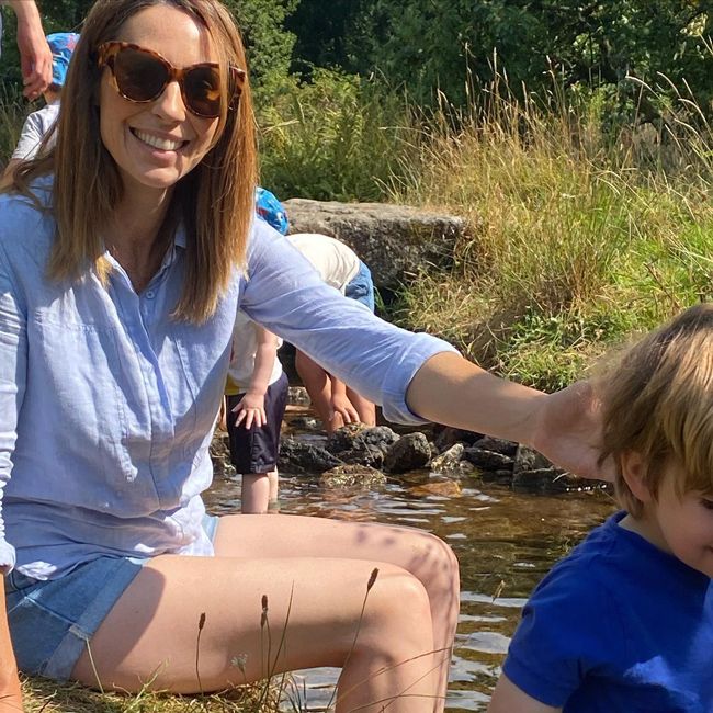 alex jones and her son paddling in a river