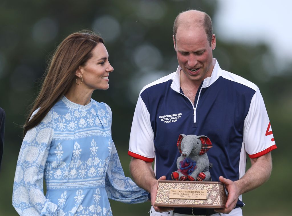 Catherine, Princess of Wales smiles at Prince William, Prince of Wales as he took part in a Charity Polo Cup 