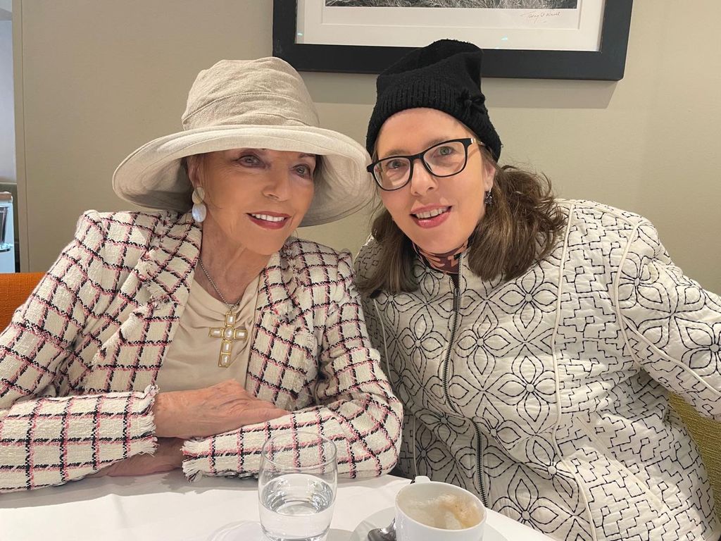 joan collins posing for photo with daughter