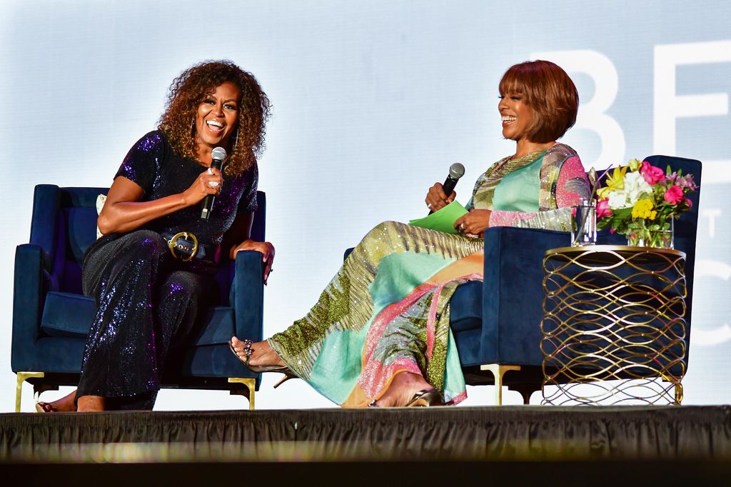 Former First Lady Michelle Obama (L) is interviewed by Gayle King during the 2019 ESSENCE Festival at the Mercedes-Benz Superdome on July 06, 2019 