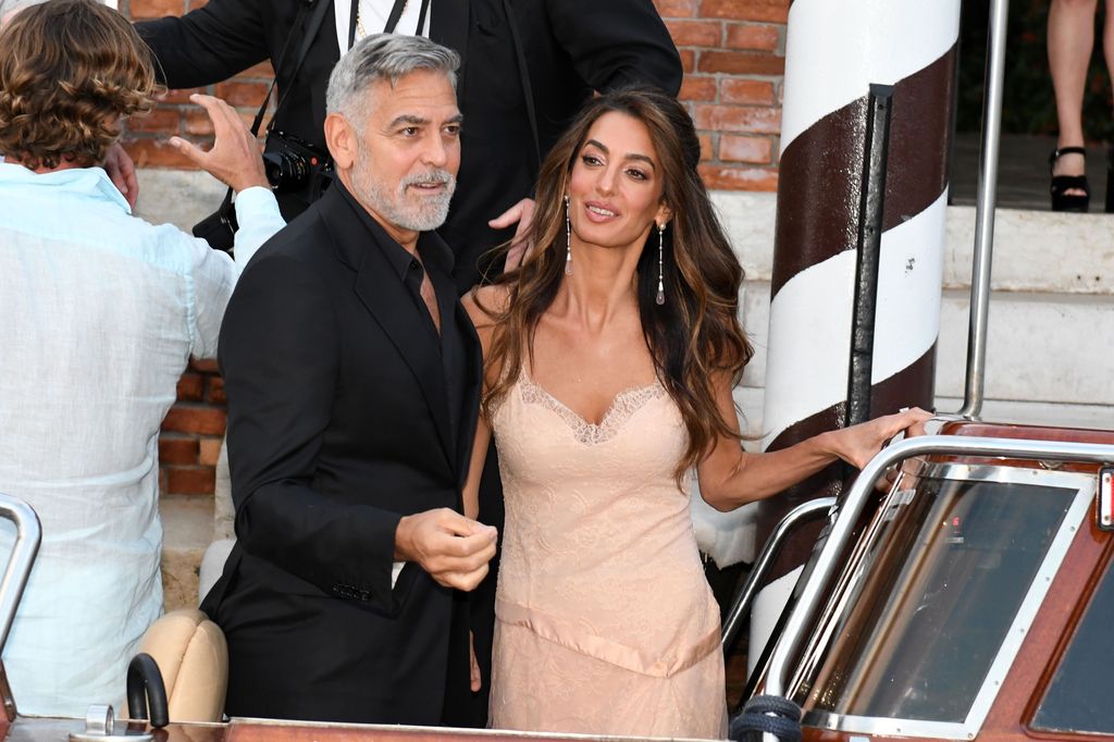 Amal and George Clooney on a boat in Venice
