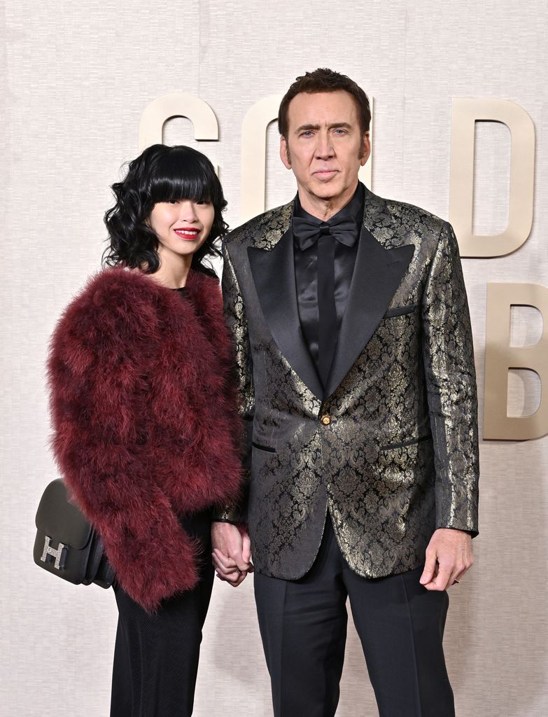 Riko Shibata standing with husband Nicolas Cage
