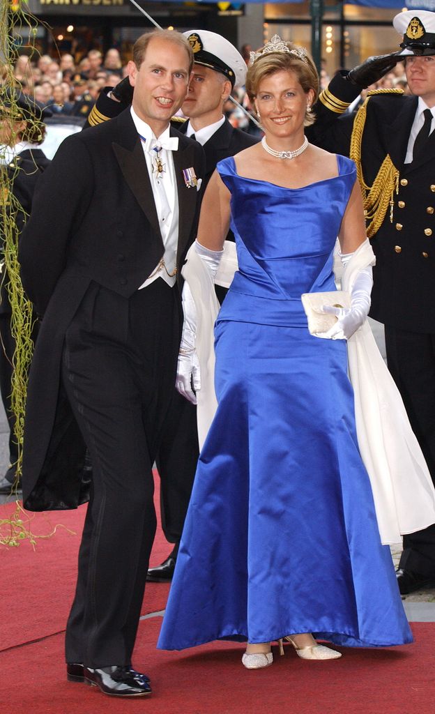 Sophie in royal blue dress with edward in formal dress